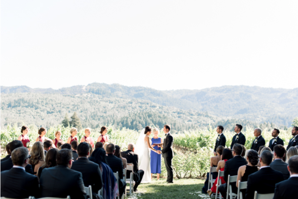Wedding ceremony at Harvest Inn overlooking wine country